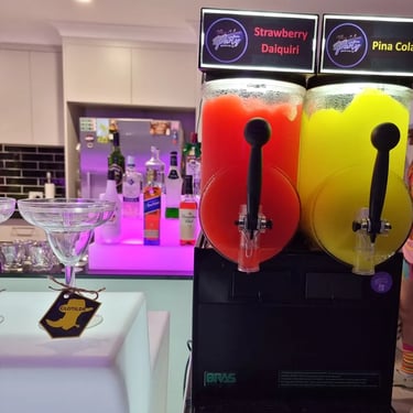 Slushie Machine next to the glow bar at a New Years party in Redlandbay, Redlands - party hire by SweetAz Co.