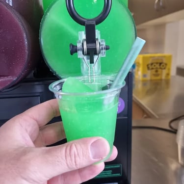 Slushie Machine icy magic in a cup during a Xmas Party in Portofbrisbane, Brisbane - party hire by SweetAz Co.