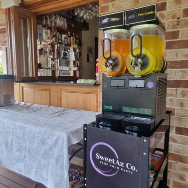 Slushie Machine at the bar window for a Xmas Party in Redlandbay, Redlands - party hire by SweetAz Co.
