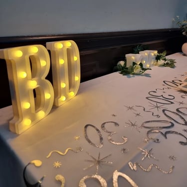 Sweetaz Crew checking out the table decorations at a Anniversary Party in Loganholme, Logan - party hire by SweetAz Co.