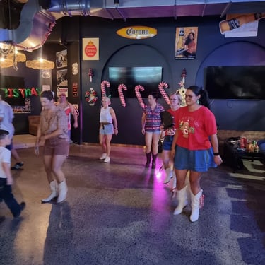 Sweetaz Crew dancing with friends at a Line Dancing event in Southport, Gold Coast - party hire by SweetAz Co.