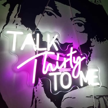 Talk thirty to me neon on a wall for Mae's 33rd birthday in Redland Bay.