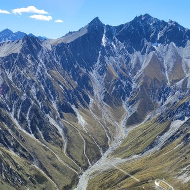 A scenic photograph from a helicopter, overlooking mountains in Central Otago, New Zealand