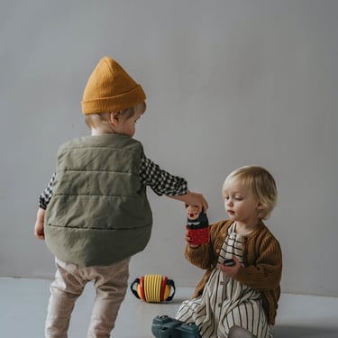 2 toddlers playing with toys