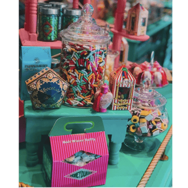 a table with a lot of candy and candies
