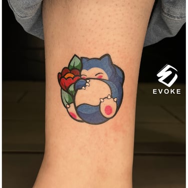 Photo of a color cartoon tattoo above the ankle