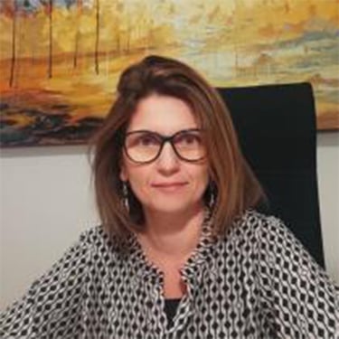 a woman in glasses and a black shirt
