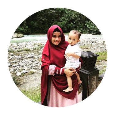a woman in a red hijab wearing a red hijab