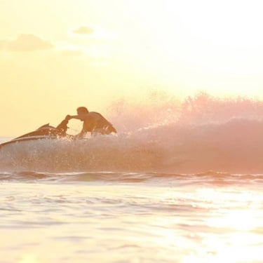 Jetski turning in evening sunlight in the ocean