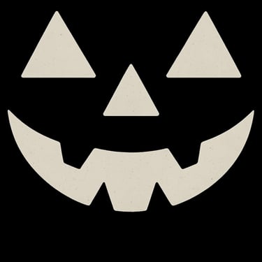 Glowing jack-o’-lantern face with triangle eyes and nose and a jagged smile