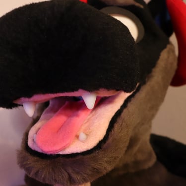 A dragon head made by Teto Creations featuring large curly horns, expressive moving eyelids and silicone teeth