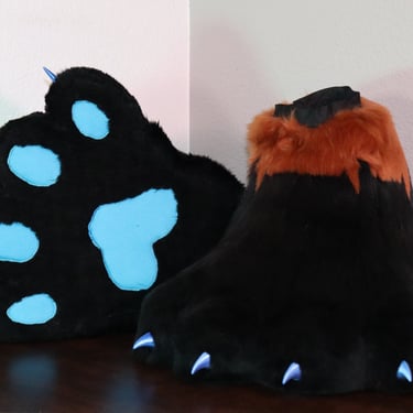 Feet paws made by Teto Creations featuring 3d-printed claws and a detailed EKG pattern