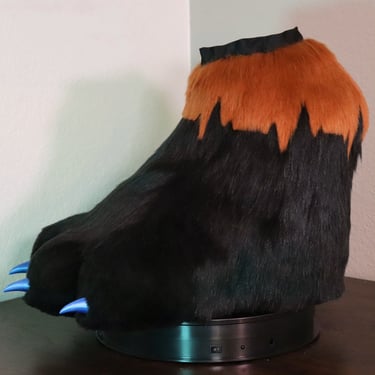 Feet paws made by Teto Creations featuring 3d-printed claws and a detailed EKG pattern