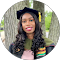 a woman in a graduation cap and gown