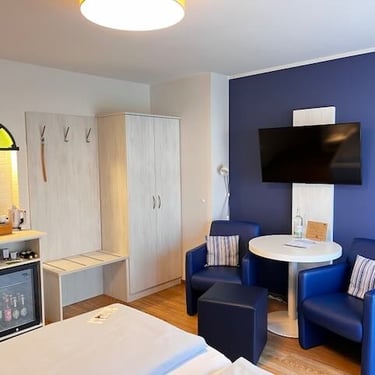 Hotel DunenNest - Komfortzimmer, Sitzecke, Flachbild-TV, Minibar