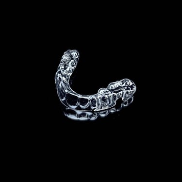 a silver ring with a chain link and a chain link