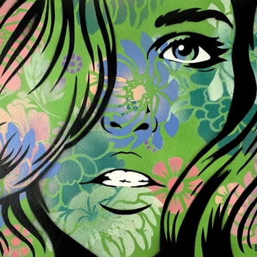 Artwork of a womans face in green spray paint