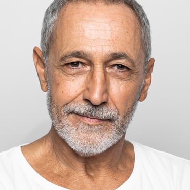 a man with a beard and a white shirt