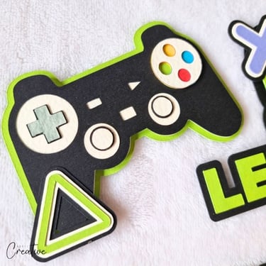Cake topper elements in a shape of joystick