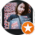 a picture of a women holding a book that has left a review 