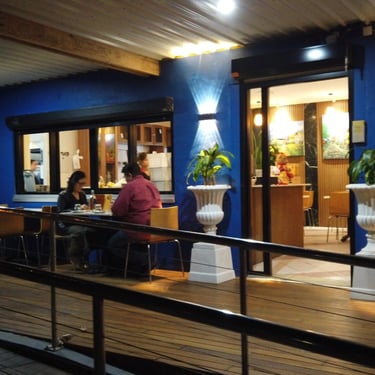 happy customers sitting outside eating at a table