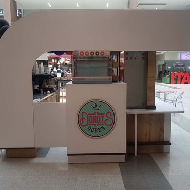 Picture of commercial isle stand designed by White and Wood Custom Carpentry in Orlando Florida