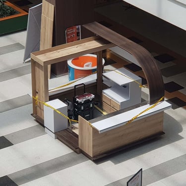 Picture of commercial isle stand designed by White and Wood Custom Carpentry in Orlando Florida