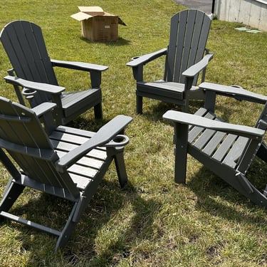 Set of 4 folding Adirondack chairs assembled for a client in Andover, MA. HDPE gray, with cup holders.