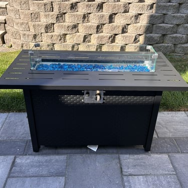 black rectangular gas firepit table with blue stones assembled for a client in North Andover, MA.