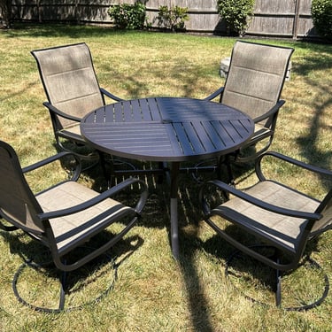 4-chair patio set assembled for a client in Peabody, MA. Black powder-coated steel with tan textile seating & backing