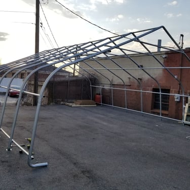 24' x 28' peak-style ShelterLogic carport frame built for a client in Burlington, MA 