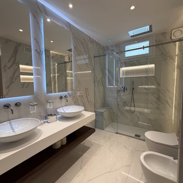 a bathroom with a large mirror and a sink