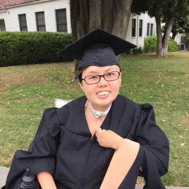 Photo of Stacey in her graduation cap and gown