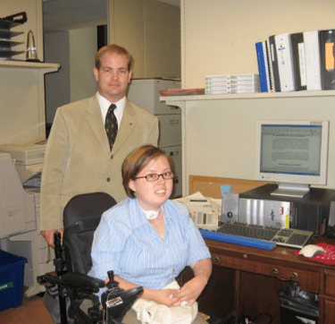Picture of Stacey as a teenager, working in an office setting during her internship in Congress. 