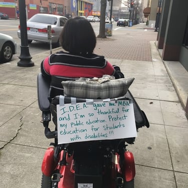 Stacey's sign "I.D.E.A gave me MBA and I'm so thankful for my public education. Protect education for students with disabilit