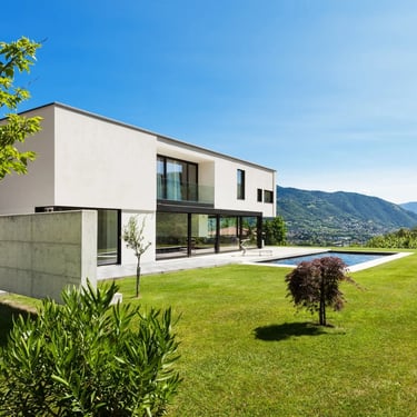a house with a pool and a pool in the background