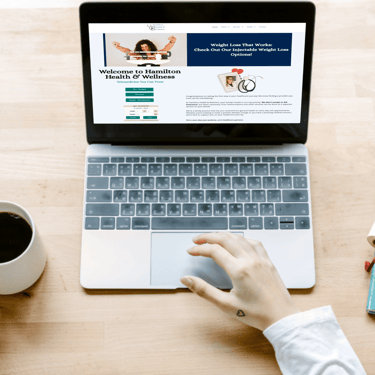Person on laptop with Hamilton Health on screen