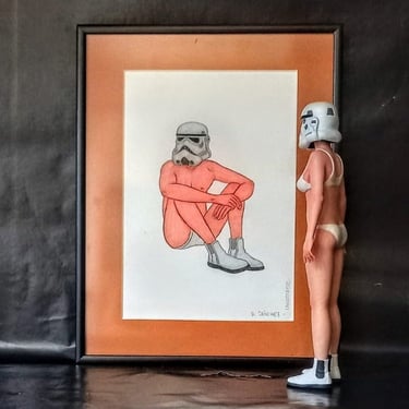 Creative Star Wars art featuring a framed Stormtrooper sketch and a matching female figure model.