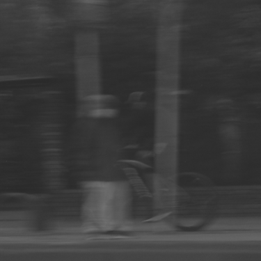 Dark, blurry silhouettes against a backdrop of deep shadows.