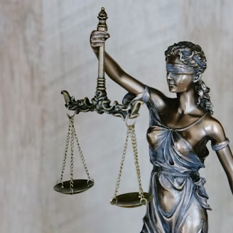 Themis, the Greek goddess of law and her trademark pose