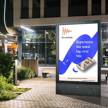 Outdoor digital billboard ad mock-up with BeastFest logo and displaying music app on smartphone and earbuds.