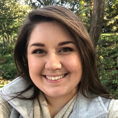 white woman smiling at camera
