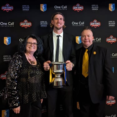 Dean and Cheryl Foulkes picture with Aden Flint.