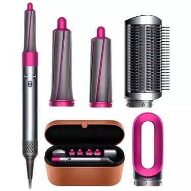 a hair dryer with a pink hair brush and a hair brush