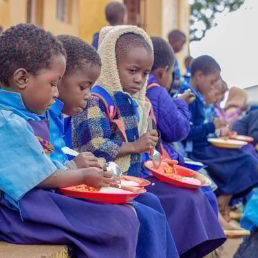 Children eating food in Malawi