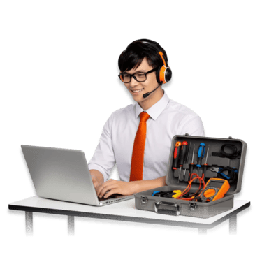 A smiling IT technician with a headset uses a laptop next to a professional tool kit for hardware repair.
