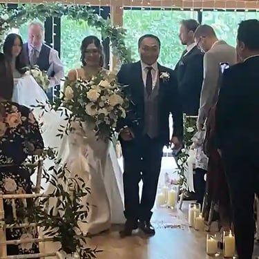 Couple Walking Down The Aisle