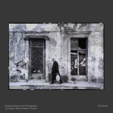 Black and white fine art photo of an elderly man passing an old building, featured in the Live Zoom Art Photography Course