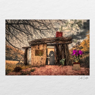 A sculptural mixed-media artwork featuring a handcrafted dwelling.