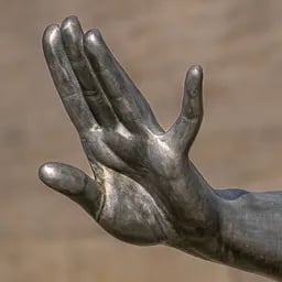 Close up on the hand of the Gymnast girl's statue.